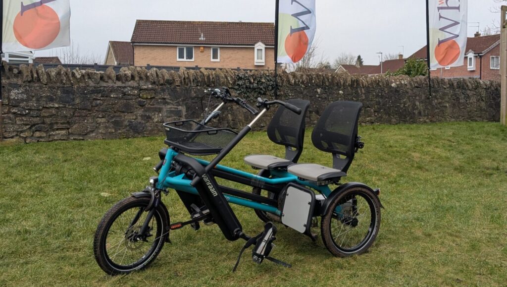 A blue tandem tricycle