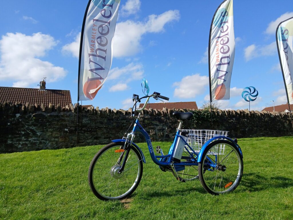 a blue pedal tricycle