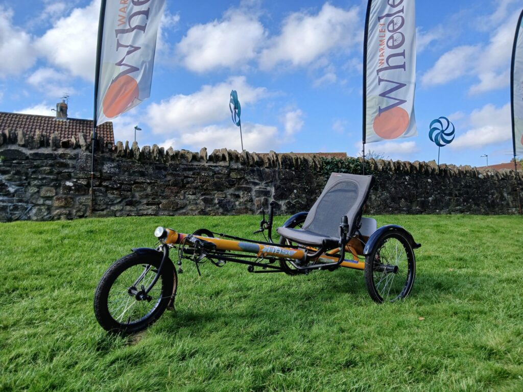 a yellow recumbent bicycle