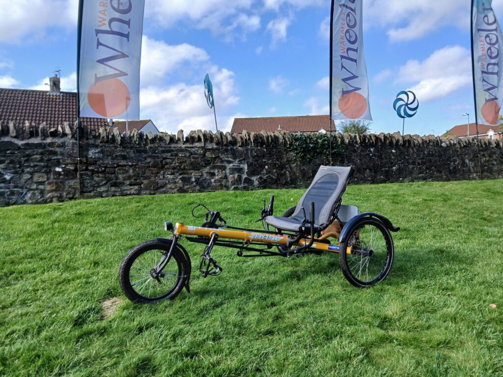 a yellow recumbent bicycle